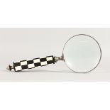 A MAGNIFYING GLASS.