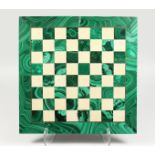 A GOOD INLAID MALACHITE CHESSBOARD. 15.5ins square.