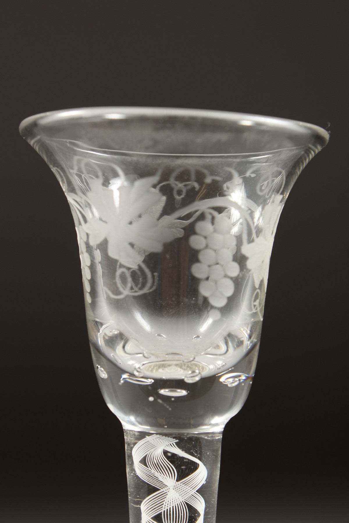 A GEORGIAN WINE GLASS, with inverted bell bowl etched with fruiting vines, with white air twist - Image 3 of 10