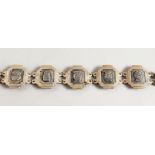 AN ISLAMIC SILVER BRACELET.