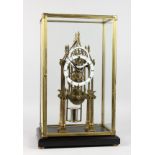 A GOOD MODERN SKELETON CATHEDRAL CLOCK with enamel chapter rings in a glass case. 21.5ins high.