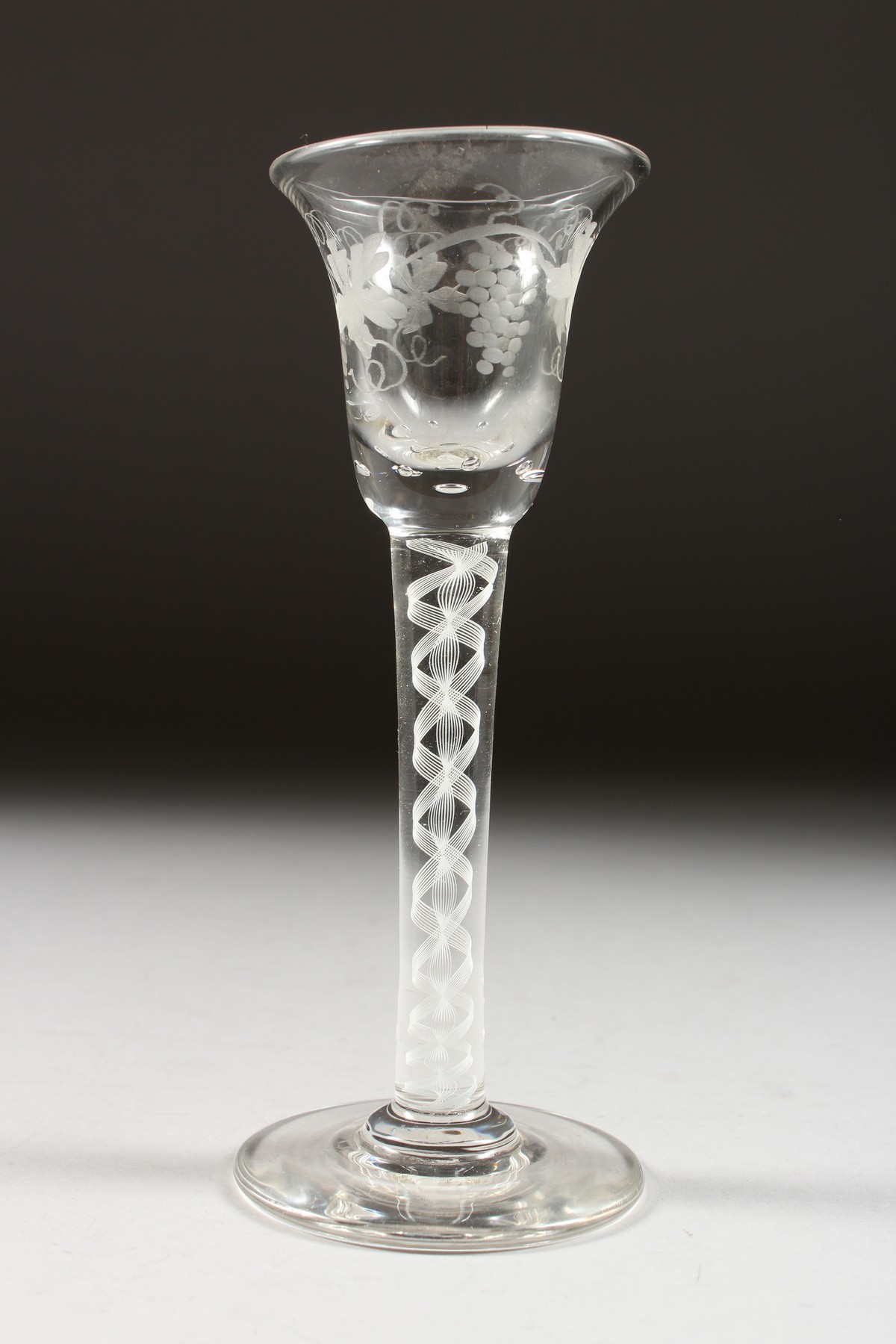 A GEORGIAN WINE GLASS, with inverted bell bowl etched with fruiting vines, with white air twist - Image 7 of 10