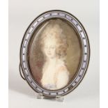 A SILVER AND ENAMEL OVAL PHOTOGRAPH FRAME, portrait head and shoulders of a young lady. 5ins x 3.