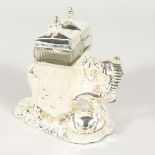 A SILVER PLATED ELEPHANT SHAPED CRUET. 4.75ins high.