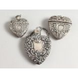 THREE HEART SHAPED SILVER PERFUME BOTTLES.