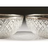 A PAIR OF SILVER BANDED CIRCULAR CUT GLASS BOWLS. 4ins diameter. Birmingham 1945.