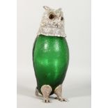 A LARGE GREEN GLASS OWL SHAPED CLARET JUG with plated mounts. 11.5ins high.