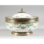A VERY GOOD SEVRES PORCELAIN SILVER MOUNTED CIRCULAR BOWL AND COVER, painted with ribbons and