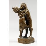 A SMALL BRONZE GROUP OF TWO CHILDREN KISSING. "Bruderlein und schwesterlein" 5.5ins high.