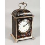 A GOOD SILVER AND TORTOISESHELL CLOCK with carrying handle on ball feet. 8ins high. London 1911.