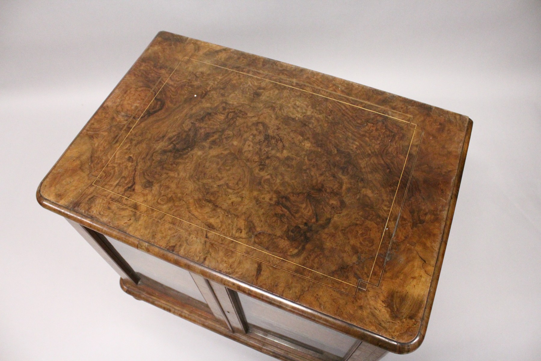 A VICTORIAN WALNUT LOW TWO DOOR MUSIC CABINET, with two shelves, on turned feet. 2ft 3ins wide x 2ft - Image 3 of 4