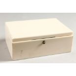 A GOOD SMALL RECTANGULAR IVORY BOX with hinged lid. 4ins long x 2.5ins wide x 1.5ins high.