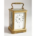 A 19TH CENTURY FRENCH BRASS ALARM REPEAT CARRIAGE CLOCK. 5ins high.
