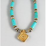 AN ISLAMIC TURQUOISE NECKLACE AND PENDANT.