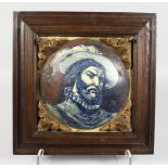 A GOOD OAK FRAMED ITALIAN POTTERY TILE, "HEAD OF A MAN". 9ins x 9ins.