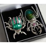 TWO SILVER RUBY AND ENAMEL BUG BROOCHES.