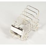 A NOVELTY PLATED CAR SHAPED TOAST RACK. 6.5ins long.