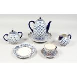 A RUSSIAN PORCELAIN BLUE AND GILT TEA SET, comprising teapot, sugar basin and cover, milk jug, six