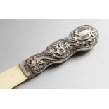 A VICTORIAN SILVER MOUNTED PAPER KNIFE. Birmingham 1894. 8ins long.