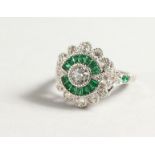 A SILVER FAUX EMERALD DECO STYLE RING.