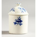 AN 18TH CENTURY MENNECY POMMADE POT AND COVER circa 1760 painted with blue flowers.