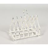 A SILVER PLATED "CROSSED GUNS" TOAST RACK.