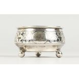 A RUSSIAN NIELLO SILVER CIRCULAR SALT, on three ball feet. 2.25ins diameter.