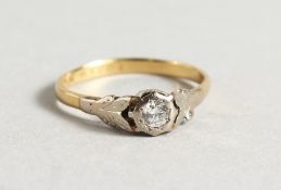 AN 18CT DIAMOND AND PLATINUM RING.