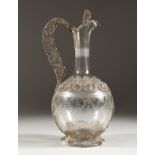 A SUPERB FILIGREE SILVER AND ETCHED GLASS CLARET JUG. 10.5ins high.