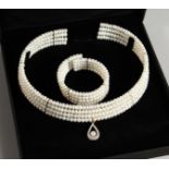 A 9CT GOLD FOUR ROW PEARL CHOKER AND BRACELET.
