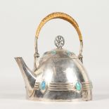 AN EARLY 20TH CENTURY WMF PLATED KETTLE, with straw-work handle and enamel decoration.