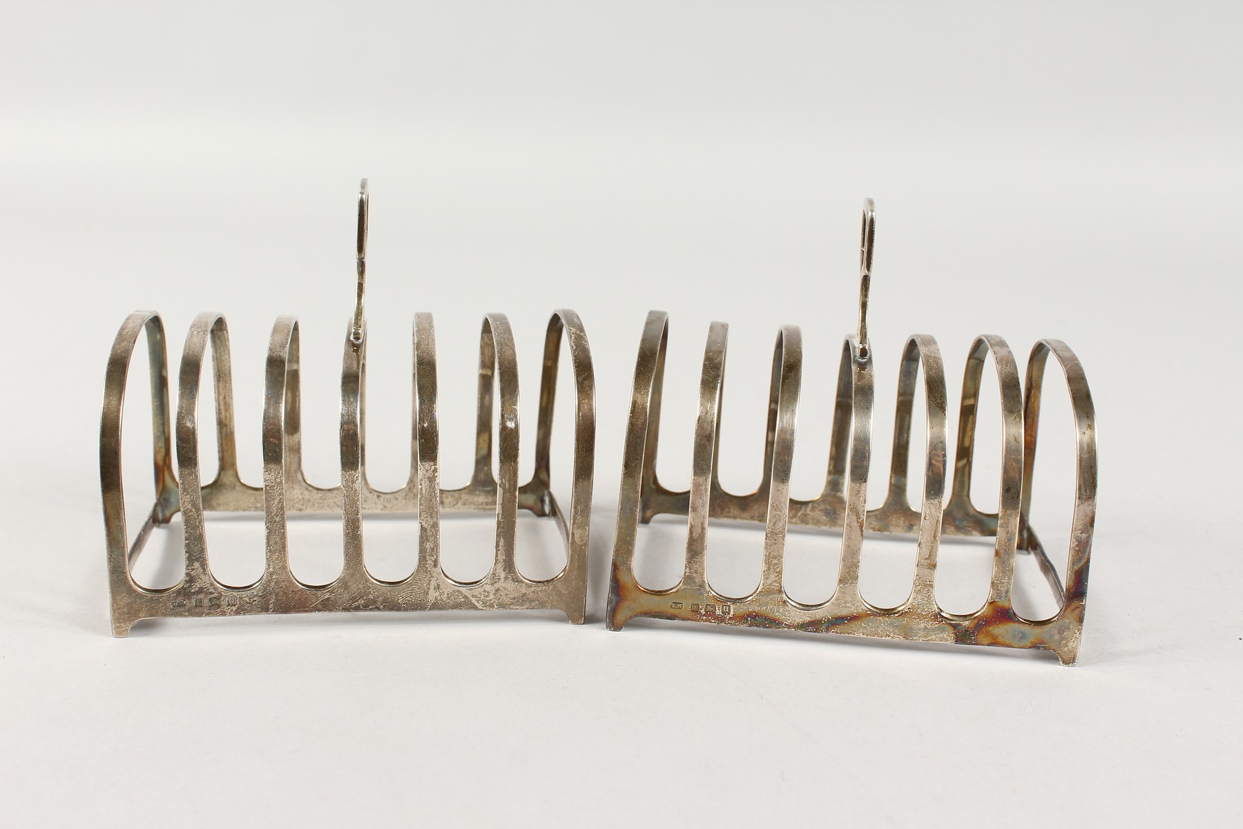 A PAIR OF SIX-DIVISION SILVER TOAST RACKS. Birmingham 1919. - Image 2 of 4