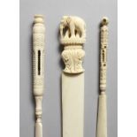 TWO CARVED IVORY STANHOPES, one of Portsmouth, 6ins long, and a paper knife carved with an elephant,