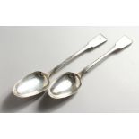 TWO SILVER BASTING SPOONS, London 1828 and 1833. Maker WB. 12ins long.