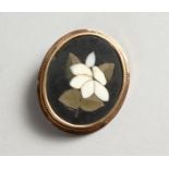 A GOLD OVAL BROOCH, with pietra dura inlaid panel.