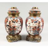 A VERY GOOD PAIR OF SAMSON OF PARIS IMARI PATTERN LAMPS, rich colours, in gilt, reds and blues.