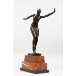 AN ART DECO STYLE BRONZE OF A DANCER on a stepped marble base. 19ins high.