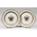 A PAIR OF SAMSON OF PARIS ARMORIAL PLATES with pierced borders. 9.75ins diameter.