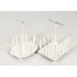 TWO CHRISTOPHER DRESSER STYLE TOAST RACKS.