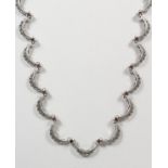 A SILVER AND MARCASITE NECKLACE.