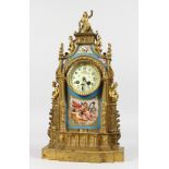 A GOOD LOUIS XVI GILT METAL AND SEVRES MANTLE CLOCK with Sevres panels, cupids and flowers, the case