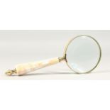 A MAGNIFYING GLASS with mother-of-pearl handle.