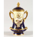 A COALPORT MINIATURE TWO-HANDLED URN AND COVER. 4.5ins high.