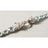 A SILVER BLUE TOPAZ CARTIER STYLE LINE BRACELET.