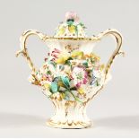 A COALBROOKDALE FLOWER ENCRUSTED TWO-HANDLED VASE AND COVER. 6ins high.