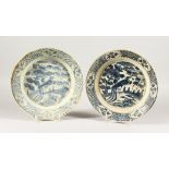 TWO CHINESE WANLI PERIOD BLUE AND WHITE PEACOCK DESIGN PLATES. 11ins diameter.