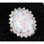 A SILVER AND GILSON OPAL DRESS RING.