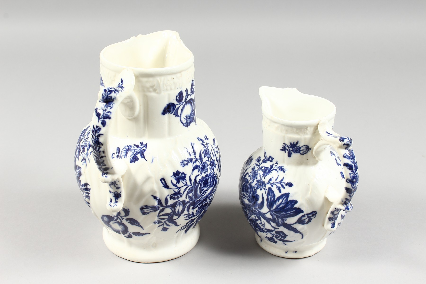 A GRADUATED PAIR OF DECORATIVE ENGLISH PORCELAIN MASK JUGS printed with fir cones and roses in - Image 5 of 9