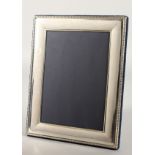 A PLAIN UPRIGHT PHOTOGRAPH FRAME with beaded border. 8.5ins x 6ins.