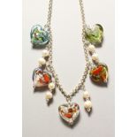 A SILVER NECKLACE with glass hearts.